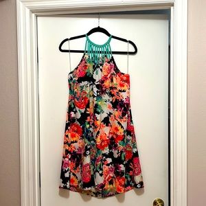 Bold floral printed A-shift dress, halter neck w/adjustable tie in the back.